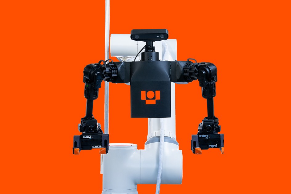 Ultra's packing robot: a black two-armed torso with a camera head and parallel grippers, mounted on a white industrial arm